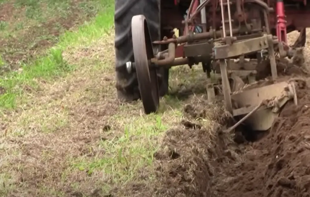 Is plowing the same as tilling?