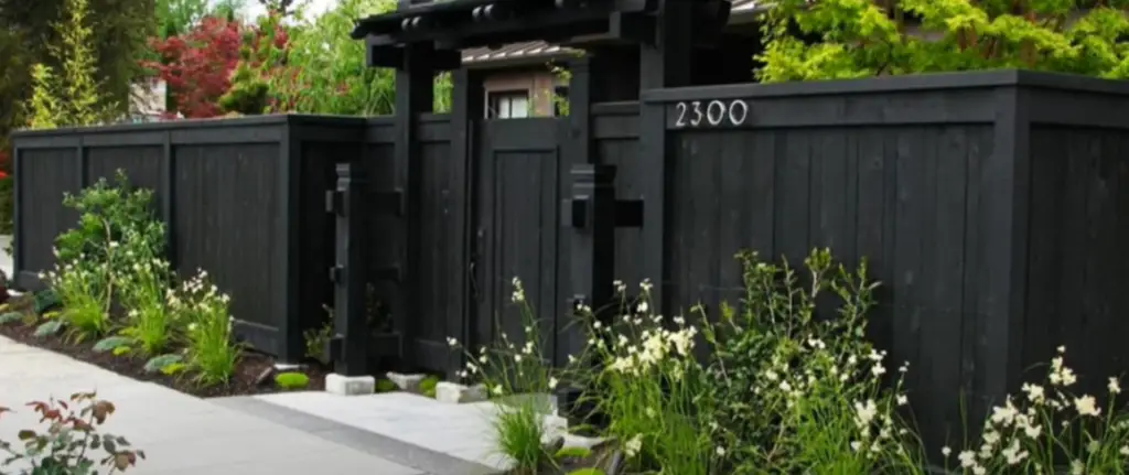 Brighten stone posts with a white gate